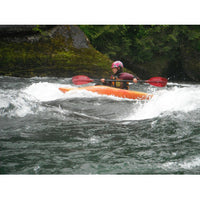 whitewater kayaking playing on standing wave