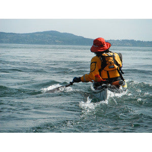 paddling kayak on edge to cross tidal current